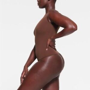 SKIMS Essential crew neck bodysuit in brown
